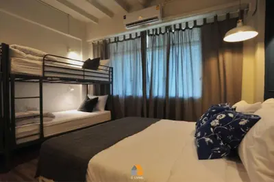 a bedroom with a bunk bed and a window at Baan Sri-kram 550m from MRT Taopoon in Bang Su