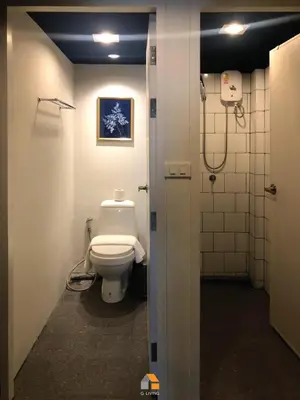 a bathroom with a toilet and a shower at Baan Sri-kram 550m from MRT Taopoon in Bang Su