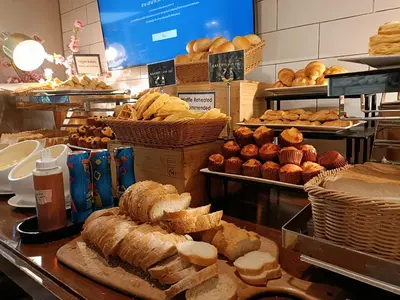 a bakery with lots of bread and pastries on display at Vince Hotel Pratunam in Bangkok