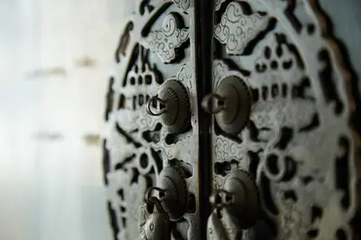 a close up of a metal door with a wheel at Spacious duplex 2 BR apartment max 6 guests - 3 min walk to BTS Nana in Bangkok