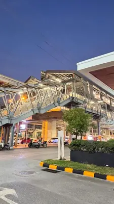 a building with a walkway over a parking lot at 94Home Donmuang in Bang Khen