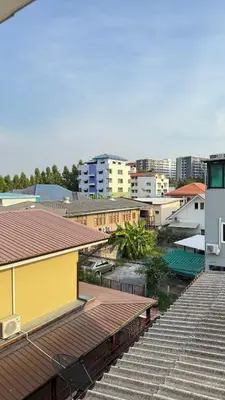 a view of a city with a yellow building at 94Home Donmuang in Bang Khen