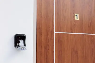 a door with a cell phone plugged into it at 94Home Donmuang in Bang Khen