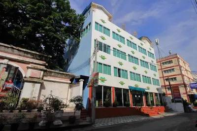a large white building on the side of a street at OYO 410 Diamond Boutique Hostel in Bangkok
