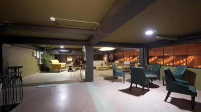 a lobby with chairs and a table and a living room at 2499 Heritage Chinatown Bangkok Hotel By RoomQuest in Bangkok