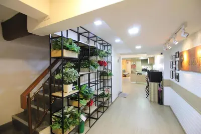 a vertical plant shelf in a hallway at Pannee Lodge Khaosan - SHA Plus in Bangkok