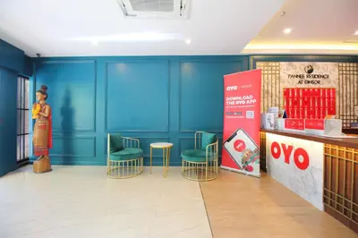 a restaurant with blue walls and chairs and a counter at Super OYO 484 Pannee Residence Khaosan Sha Plus in Bangkok