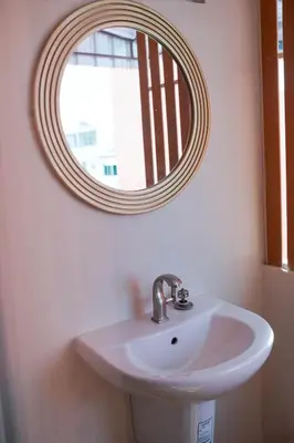 a bathroom with a sink and a mirror at Apartment Near Big Buddha in Bangkok Yai