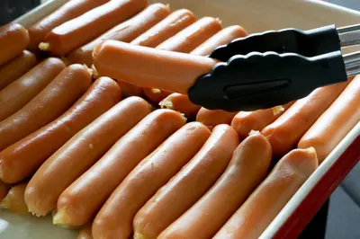 a bunch of hot dogs on a tray at The Riche Boutique Hotel Don Mueang Airport in Bangkok