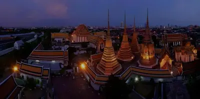 a view of a large building at night at XX GO INN The Grand Palace - MRT Samyot Station in Bangkok