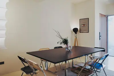 a dining room with a table and chairs at Charming Minimal 3BR Home Near BTS Ari, Bangkok in Sathani Bang Su