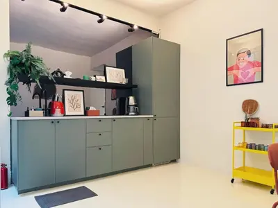 a room with a green cabinet and a shelf at Charming Minimal 3BR Home Near BTS Ari, Bangkok in Sathani Bang Su