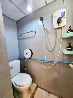 a bathroom with a toilet and a shower at 804-STP Homely room Free Wi-Fi and Near BTS line in Bangkok
