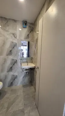a bathroom with a sink and a mirror at Tawan Room#5 in Bangna