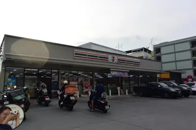 a group of motorcycles parked in front of a store at Tawan Room#5 in Bangna