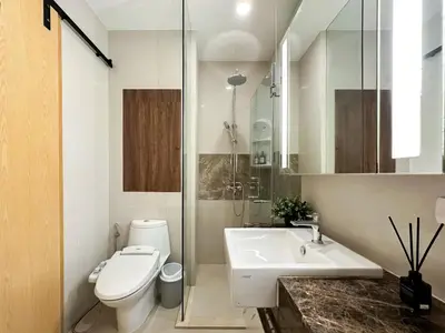 a bathroom with a toilet and a sink at Modern Expansive - Ultra Fast WiFi - BTS Phrom Phong in Bangkok