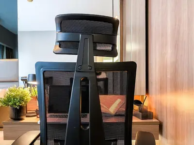 a computer monitor sitting on top of a desk at Exquisite Modern 1BR - Ultra Fast Wifi - BTS Thong Lo in Bangkok