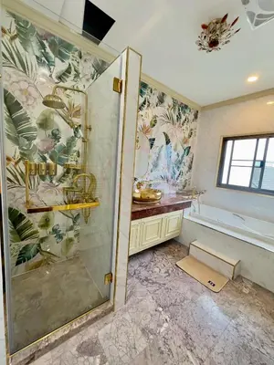 a bathroom with a shower and a bath tub at บ้านคุณนาย BaanKhunNaiPhaholyothin24 in Bangkok