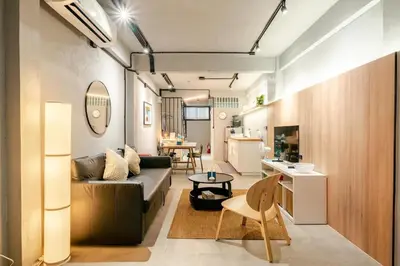 a living room with a couch and a table at Rare Bangkok Townhouse Perfect for Groups, 8 mins to Train in Bangkok