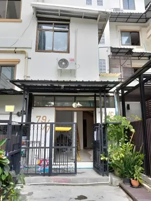 a house with a gate in front of it at XX Mitr INN Sukhumvit 2 - BTS Nana in Bangkok