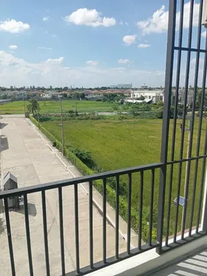 a balcony with a view of a park at VS Place in Nonthaburi