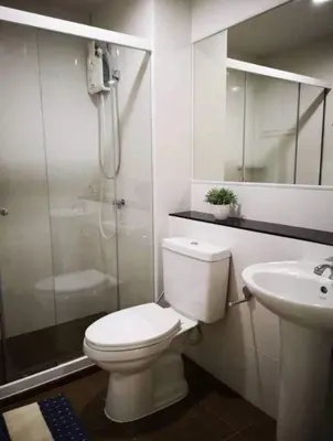 a bathroom with a toilet and a shower and a sink at Fiber Wifi 850m to BTS Onnut in Bangkok