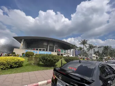 a car parked in a parking lot in front of a building at 4 guests condo near Impact, Wi-Fi & washer C5 in Ban Bang Phang