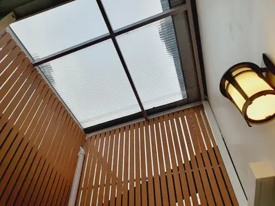 a room with a large window and a light at Comfy Townhome 5min walk to 7-11 in Ban Nong Bua