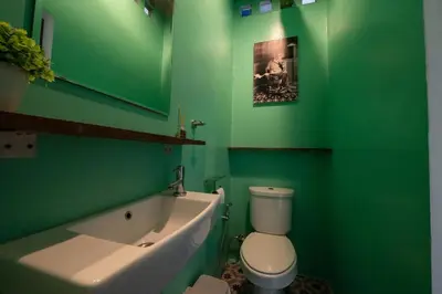 a green bathroom with a toilet and a bath tub at Rooftop at Ladprao The Mall Bangkapi BTS 4BR with Lift in Ban Bang Toei (1)
