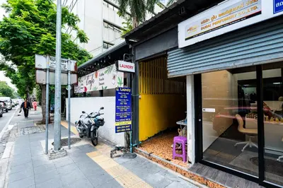 a motorcycle parked outside of a store on a street at XX Oh My Nap BTS Nana - โอ้ มาย แน็ป บีทีเอส นานา in Bangkok