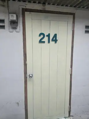 a white door with the number on it at 214 Lovely apartment with private bathroom and WiFi in Bangkok