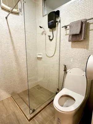 a bathroom with a shower and a toilet at Indigo Studio 2 mins from SRT Wat Samien Nari in Bangkok