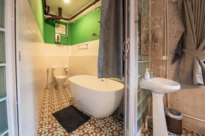 a bathroom with a toilet and a tub and a sink at Sao Chingcha Near Khao San Road MRT 3 bathtub in Bangkok