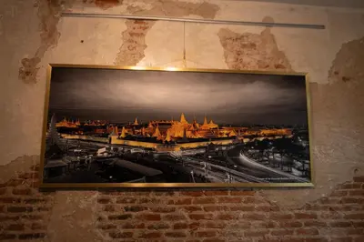 a picture hanging on the wall of a building at Sao Chingcha Near Khao San Road MRT 3 bathtub in Bangkok