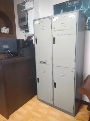 a pair of lockers in a room with a counter at Stay Hostel in Bangkok