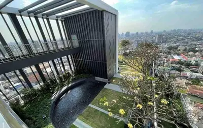 a balcony with a view of a city at 2BR Condo with Oldtown Bangkok Vibes, Steps from Wongwian Yai in Bangkok