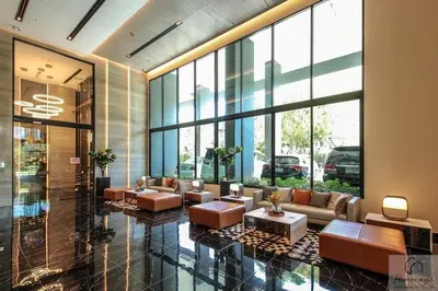 a lobby with couches and tables in a building at 2BR Condo with Oldtown Bangkok Vibes, Steps from Wongwian Yai in Bangkok