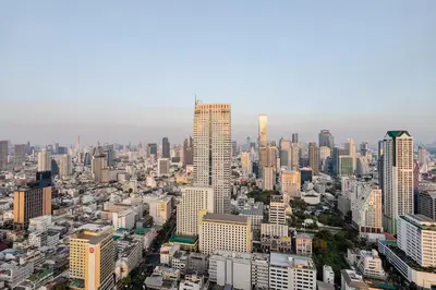 an aerial view of a city with tall buildings at State tower City view Central River Station in Bangkok