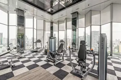 a gym with treadmills and exercise equipment in a building at 2BR 2BA Luxury Lifestyle 5min walk Thonglor BTS in Bangkok