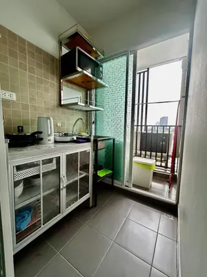 a kitchen with a sink and a window in a room at Comfy1BR at Bangson byBB in Bangkok