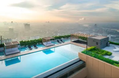 a swimming pool on top of a building at River Cando Perfect for relaxing in Ban Sai Ma