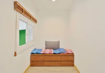 a bed in a room with a window at Bangkok Japanese designed 3BR Home Ekkamai BTS in Bangkok