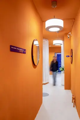 a hallway in a hospital with a mirror on the wall at Blue House 191 Hometel in Chinatown