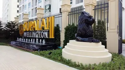 a statue of a lion in front of a building at Supalai Wellington 2 in Ban Na Song