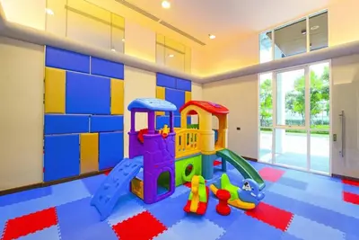 a childs room with a play room with a play set at Supalai Wellington 2 in Ban Na Song