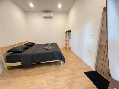 a bedroom with a bed and a walk in closet at นวมินทร์ 76 พูลวิลล่า - Nawamin 76 Poolwilla in Ban Baen Phichit