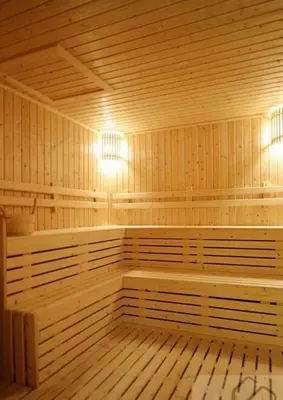a large wooden sauna with two benches and lights at Supalai Wellington 2, near MRT in Sathani Khlong Tan