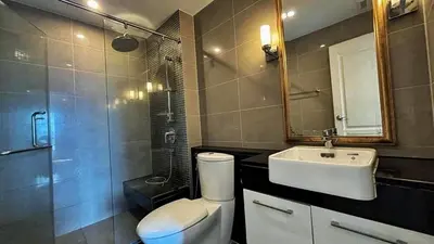 a bathroom with a toilet and a sink and a shower at Supalai Wellington 2, near MRT in Sathani Khlong Tan