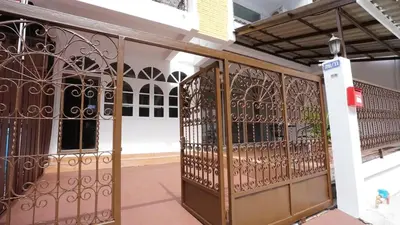 an entrance to a building with an iron gate at BTS Asoke 6bedroom townhouse in Bang Kapi