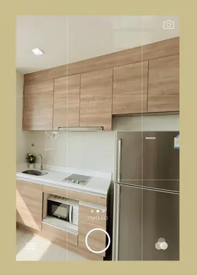 a kitchen with wooden cabinets and a stainless steel refrigerator at \u8f89\u714c\u8c61\u795e\u5e99\u5168\u914d\u5957\u8bbe\u65bd\u9ad8\u7aef\u516c\u5bd3 \u5b89\u9759\u4e0d\u4e34\u8857 \u8fd1\u5730\u94c1\u591c\u5e02 in Bangkok